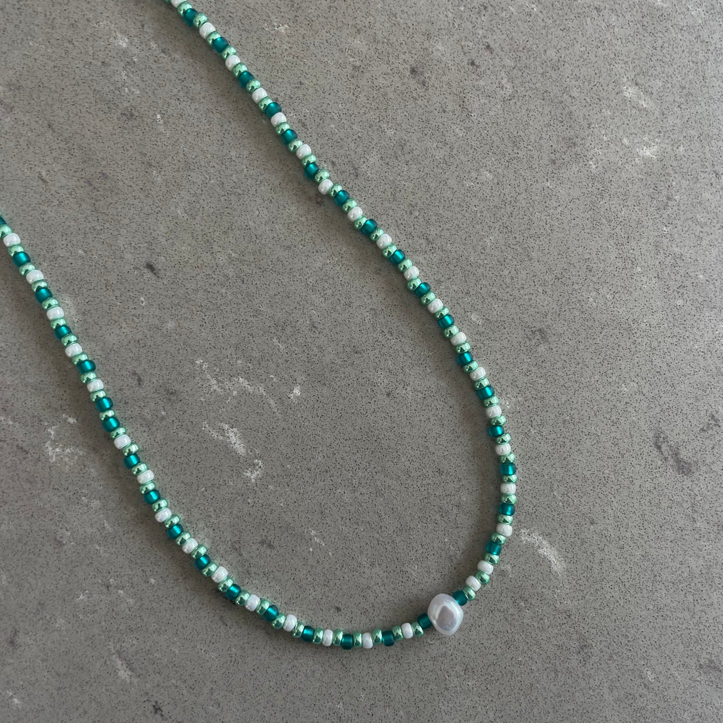 Green/white pearl necklace