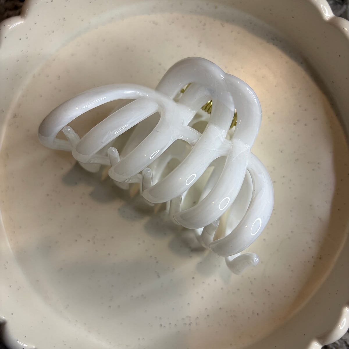 White hairclip