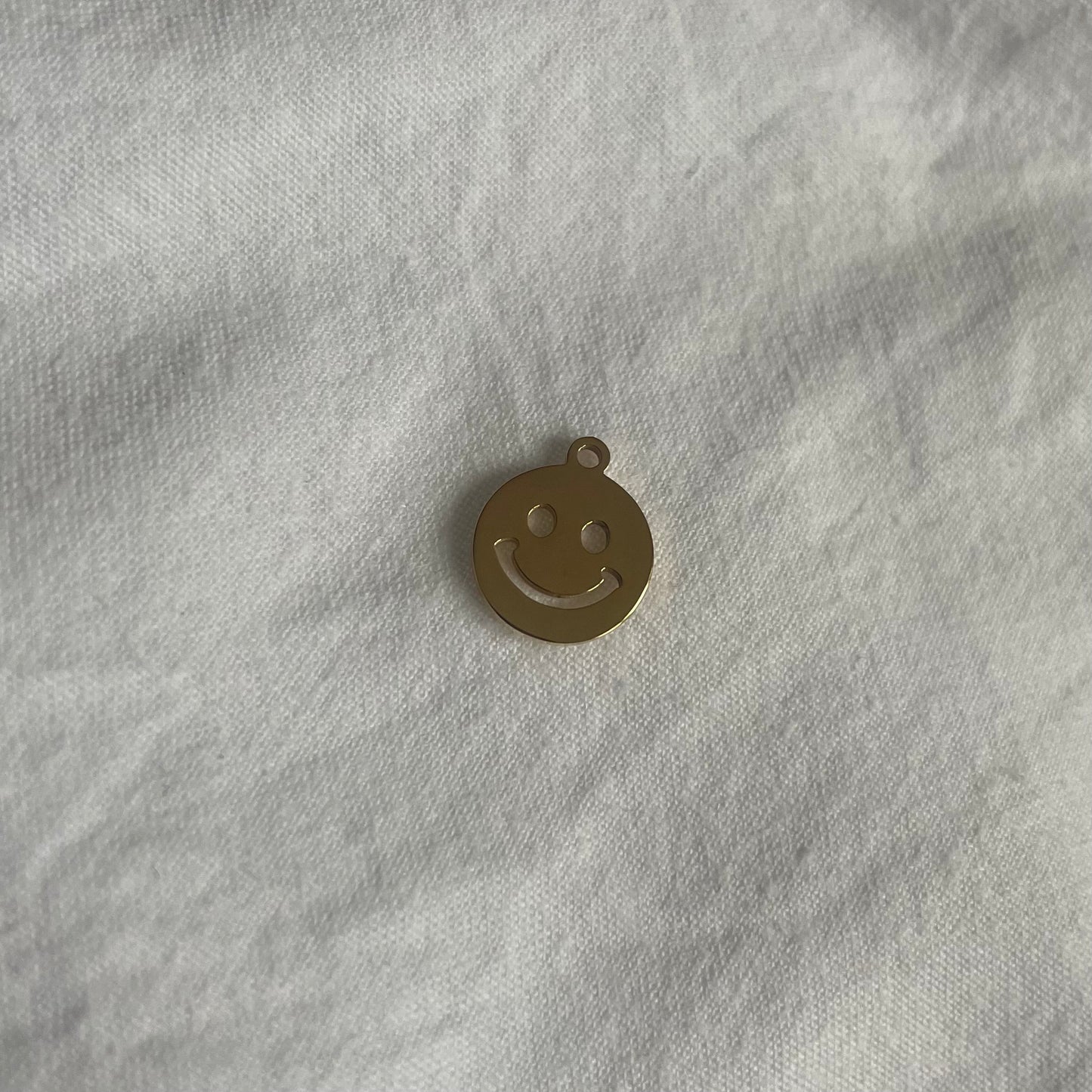 Charm: gouden smiley